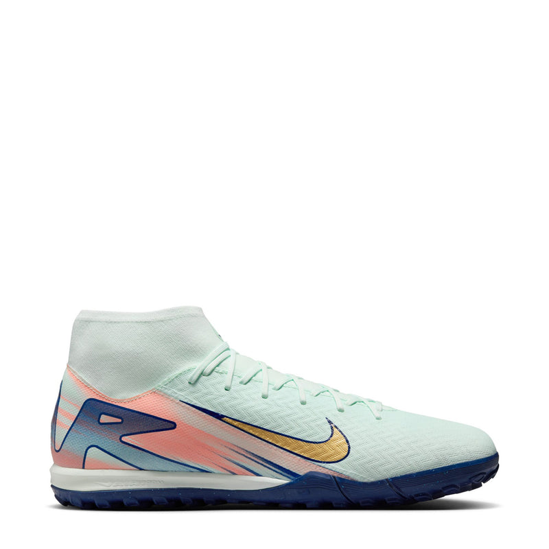 Men's turf soccer cleat in light mint with gold swoosh and blue/pink accents
