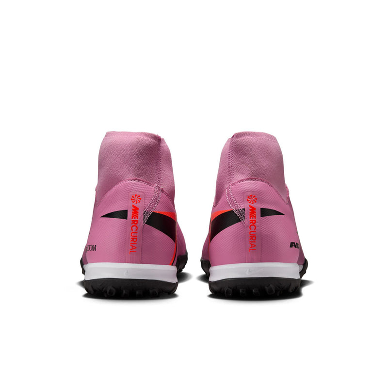 Men's pink turf soccer cleats rear view with black heel counter and crimson accents
