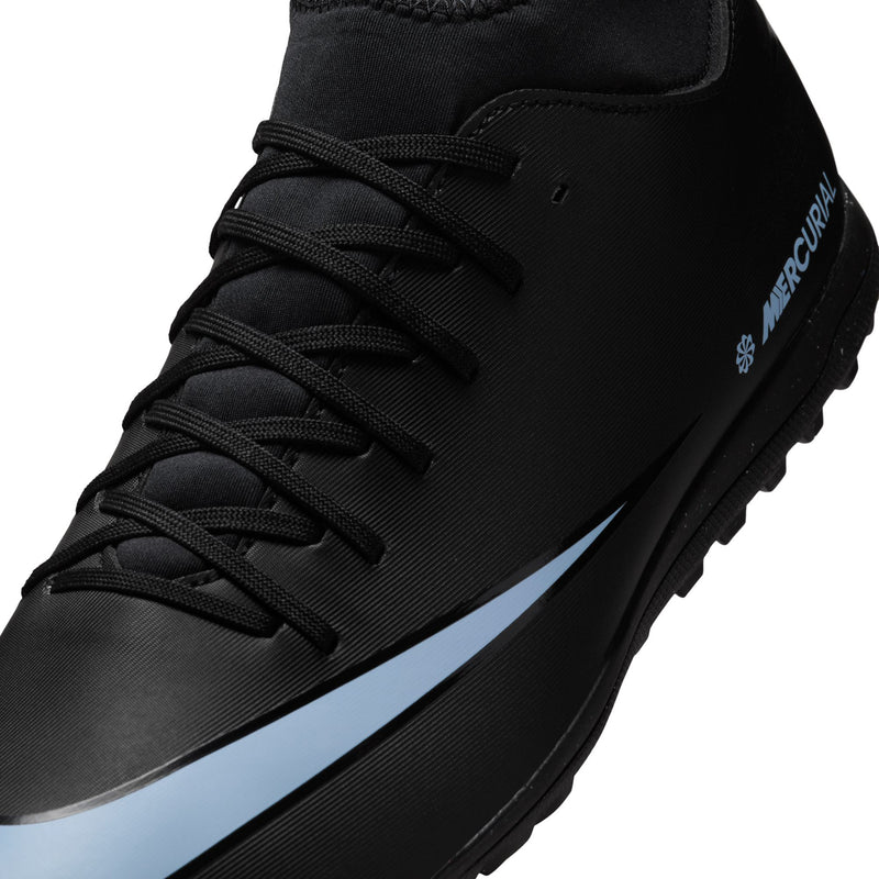 Close-up men's black lace-up turf cleat with ice blue side stripe