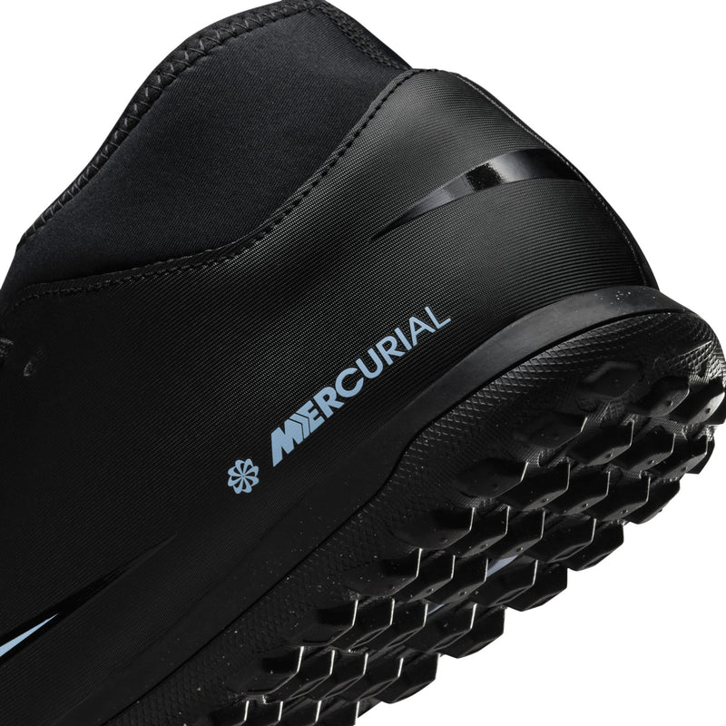 Close-up black turf cleat heel with MERCURIAL logo and ice blue accent edge