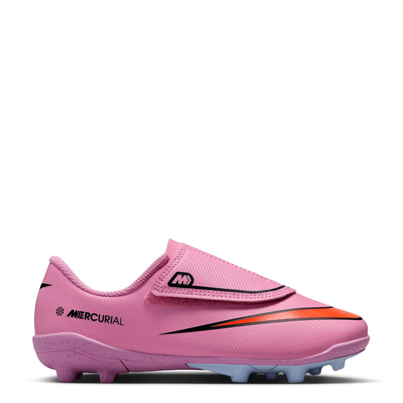 Kids pink soccer cleat with black heel strap and textured upper