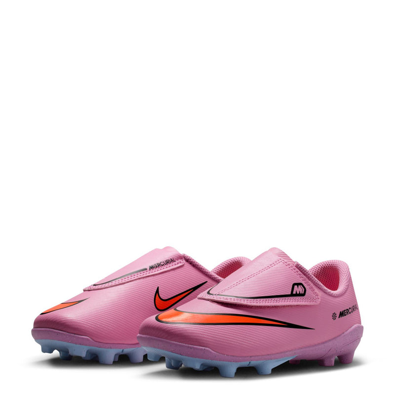Kids pink soccer cleat with blue-gray studs and orange-black speed stripe