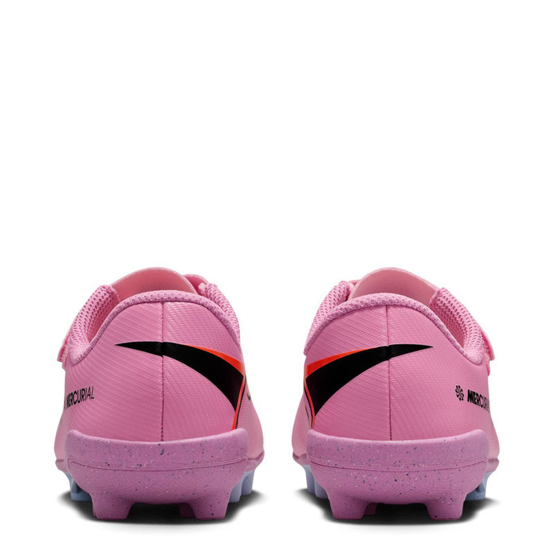 Kids pink soccer cleats rear view with black stripe and purple outsole