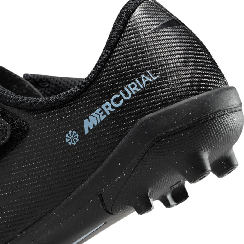 Kids black soccer cleat close-up of heel logo and studded outsole