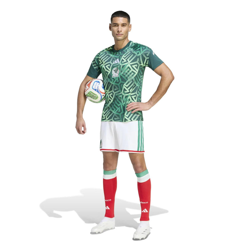 Men's green Mexico pre-match jersey with geometric print, paired with white shorts and red trim