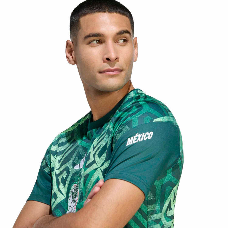 Men's green Mexico pre-match jersey close-up, Mexico wordmark on sleeve, geometric print
