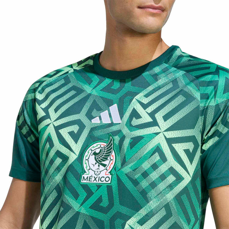 Men's green Mexico pre-match jersey chest close-up, adidas logo and Mexico crest