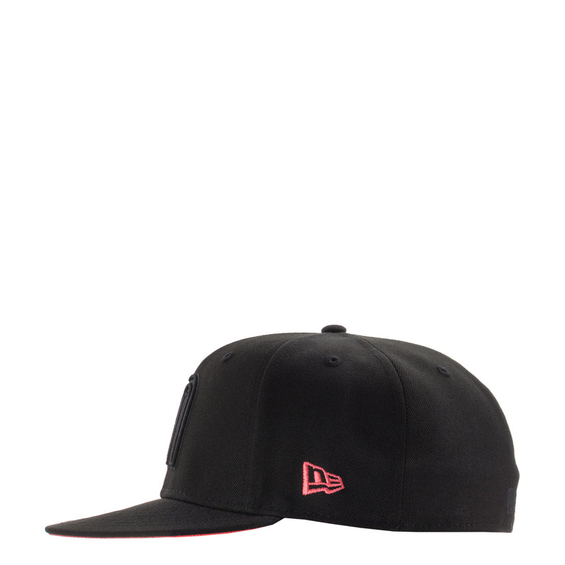 Black baseball cap with red outlined triangular logo on front