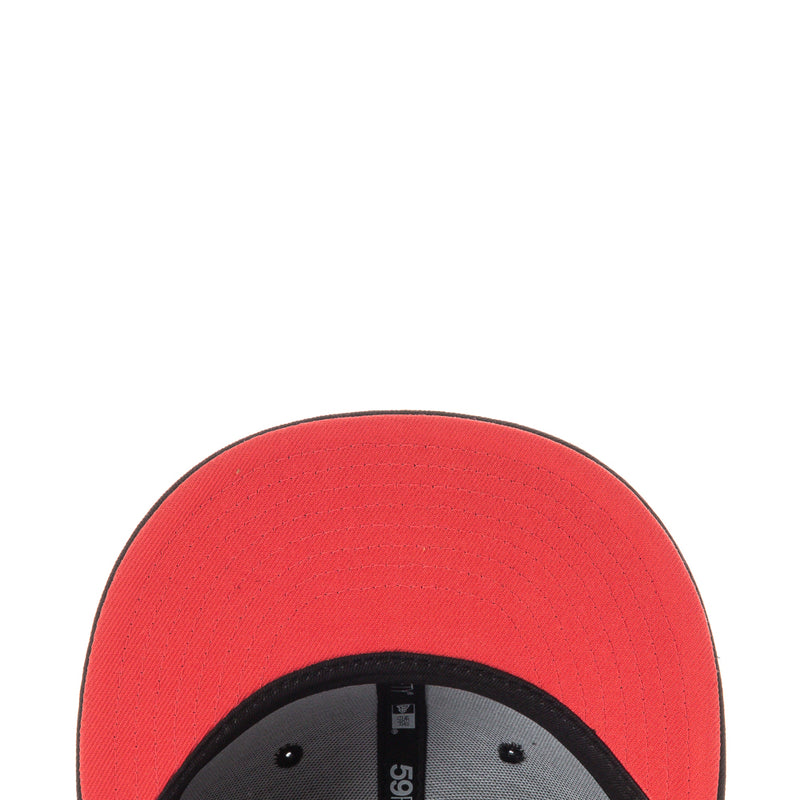 Red cap crown with black inner brim and gray sweatband close-up