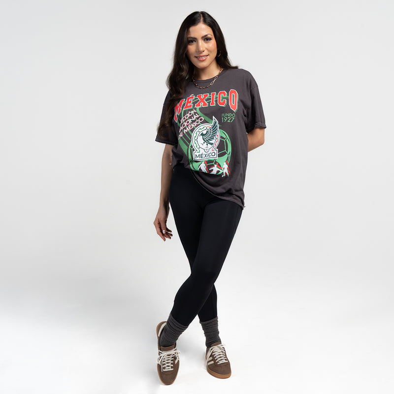 Unisex black washed T-shirt with Mexico graphic, model standing in angled view