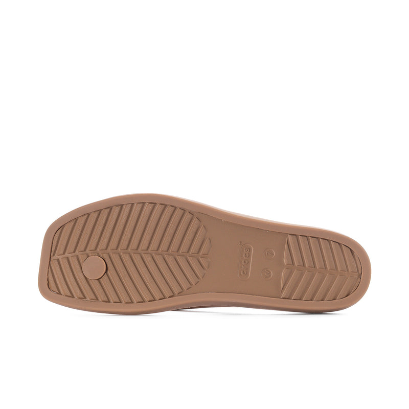 Milk chocolate flip-flop outsole with traction tread and circular logo