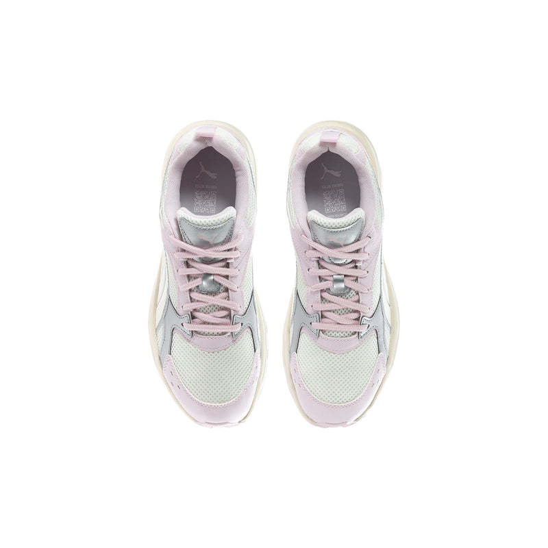 Youth sneakers in cream and pastel pink, shown from above with lace-up closure