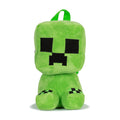 Green plush backpack with Minecraft-style face and black square eyes; front loop straps