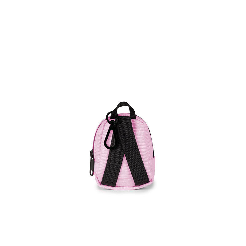 JanSport mini backpack in Pink Ice with black straps and side zipper pull