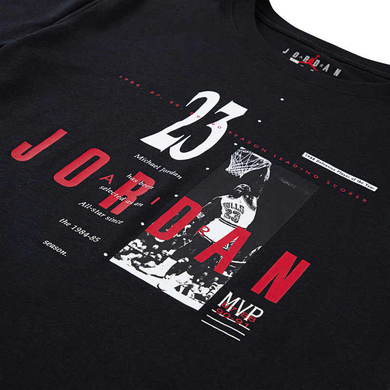 Youth graphic T-shirt close-up: 23 Jordan text and MVP graphic in red, white, and black