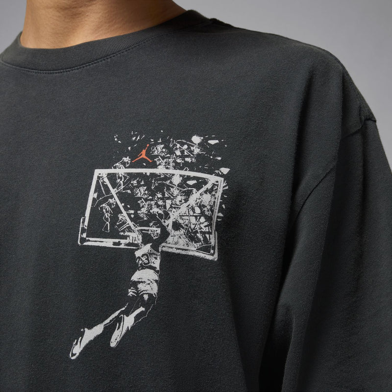 Black crewneck T-shirt close-up of chest graphic print