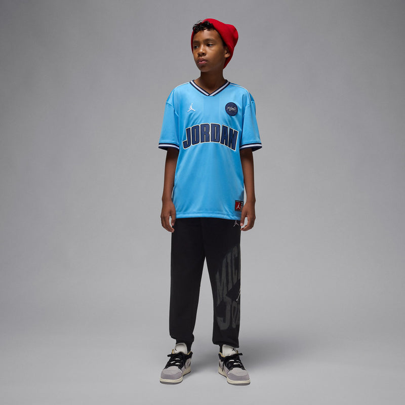 Youth light blue basketball jersey with JORDAN front print and Jumpman side logo