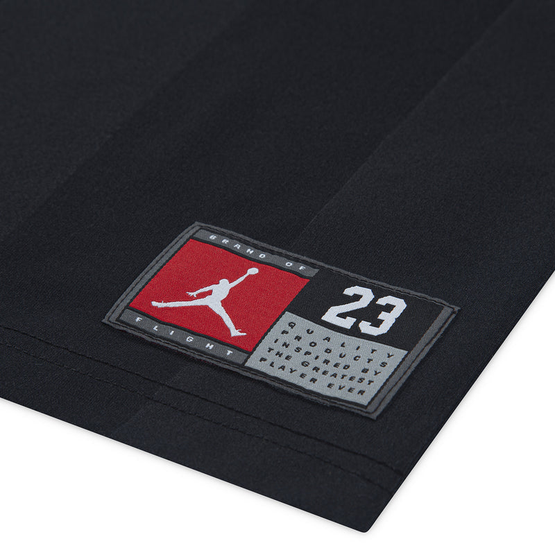 Black jersey hem patch with red stripe, Jumpman mark, and number 23