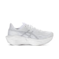 Women's white lace-up running shoes with textured knit upper and cushioned sole