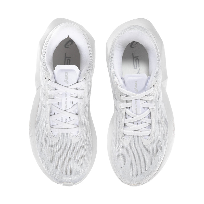 Women's white lace-up sneakers showing tongue, laces, and cushioned interior collar