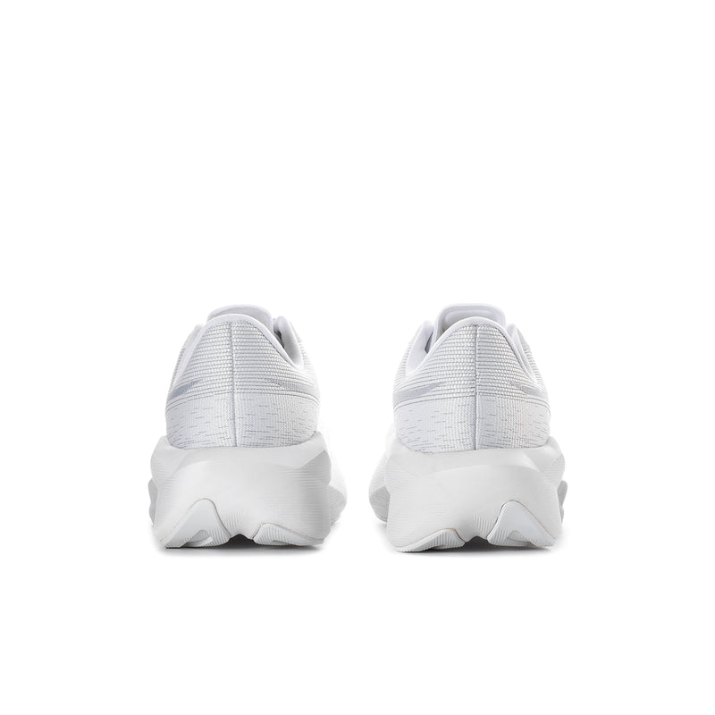 Women's white running shoes from heel view with padded back and thick sole