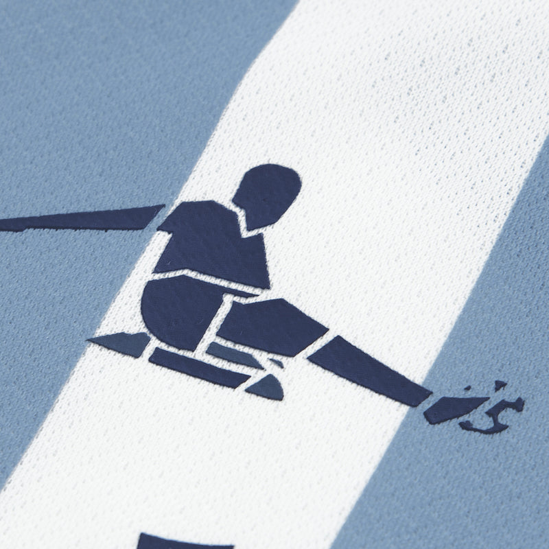 Light blue jersey fabric with navy player graphic and bold stripe pattern