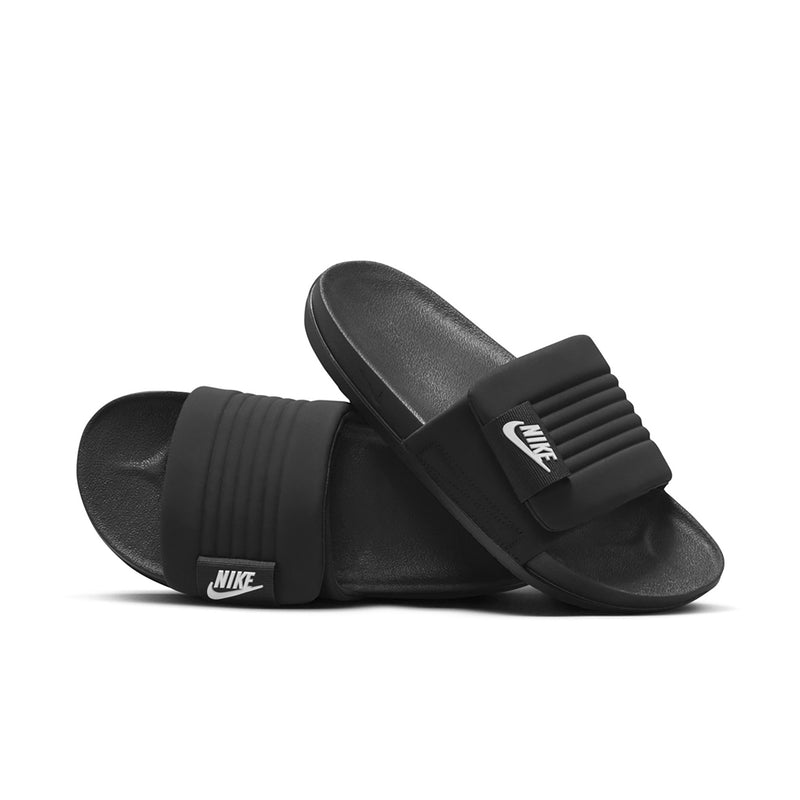 Black slide sandals with contoured footbed and NIKE logo on strap