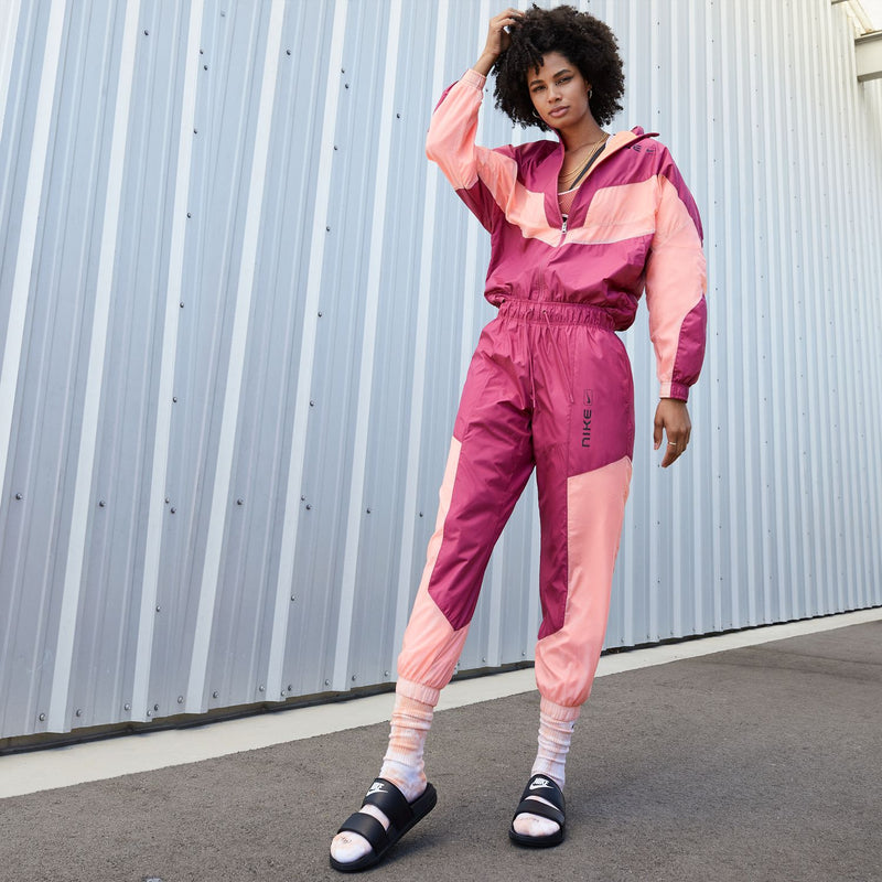 Women's black Nike slide sandals on model's feet