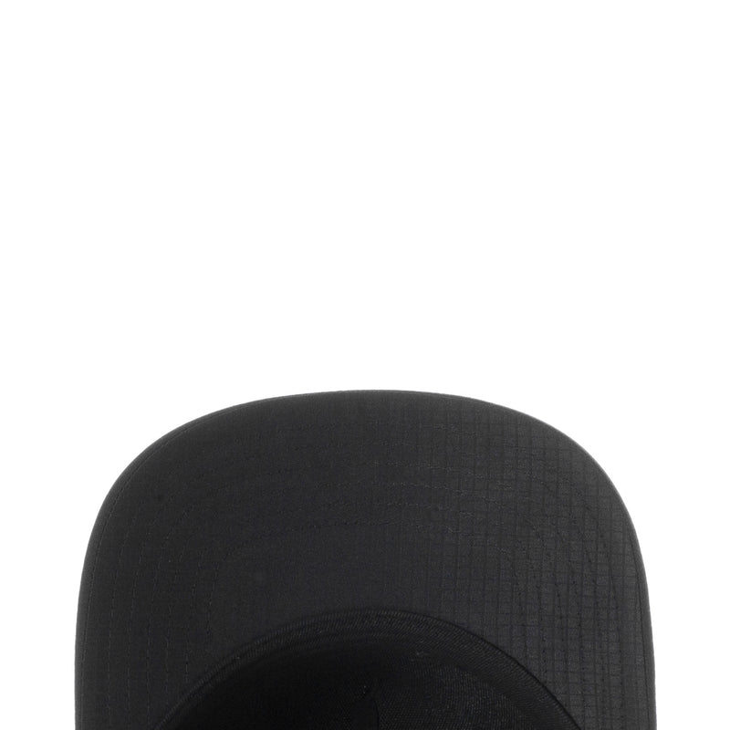 Black snapback cap crown with textured fabric