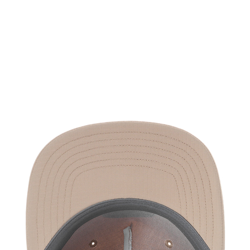 Light beige cap crown close-up with ventilated stitching on the brim.