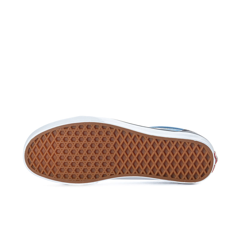 Men's low-top sneaker outsole, brown tread with white edge and navy upper