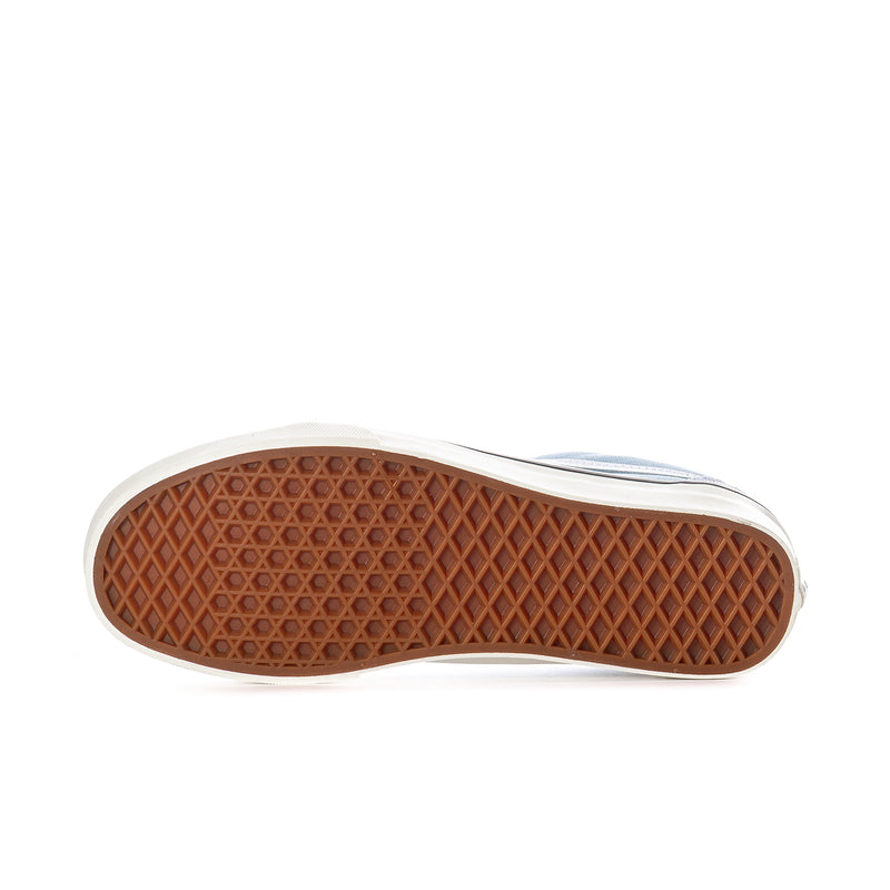 Men's low-top canvas sneakers outsole view with brown tread and white edge