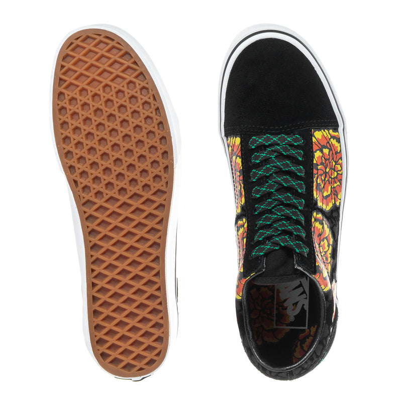 Black sneakers with marigold floral side panel, showing white rubber outsole