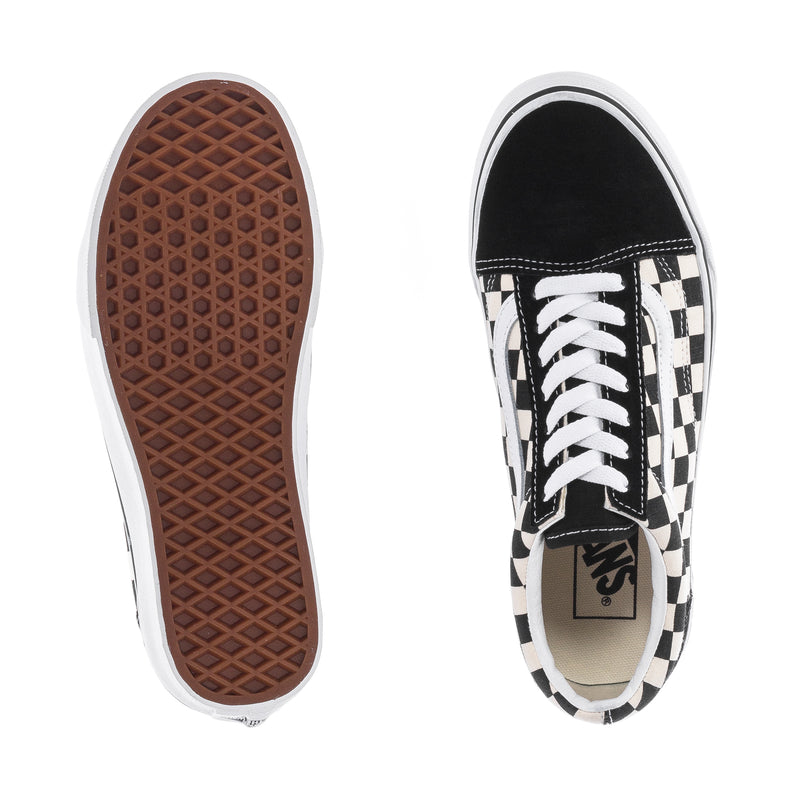 Youth checkerboard sneakers with textured gum outsole and black-and-white toe profile