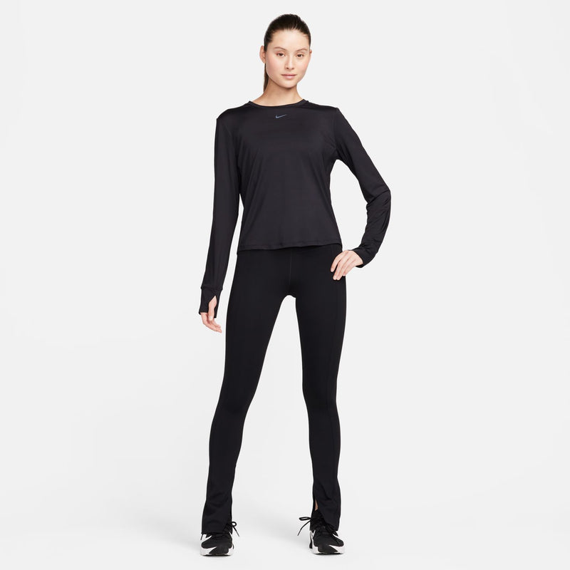 Women's black long-sleeve Dri-FIT top with Nike swoosh, worn with leggings