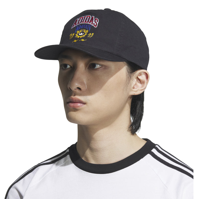 Black 5-panel strapback cap with curved brim and embroidered ADIDAS graphic; side view.