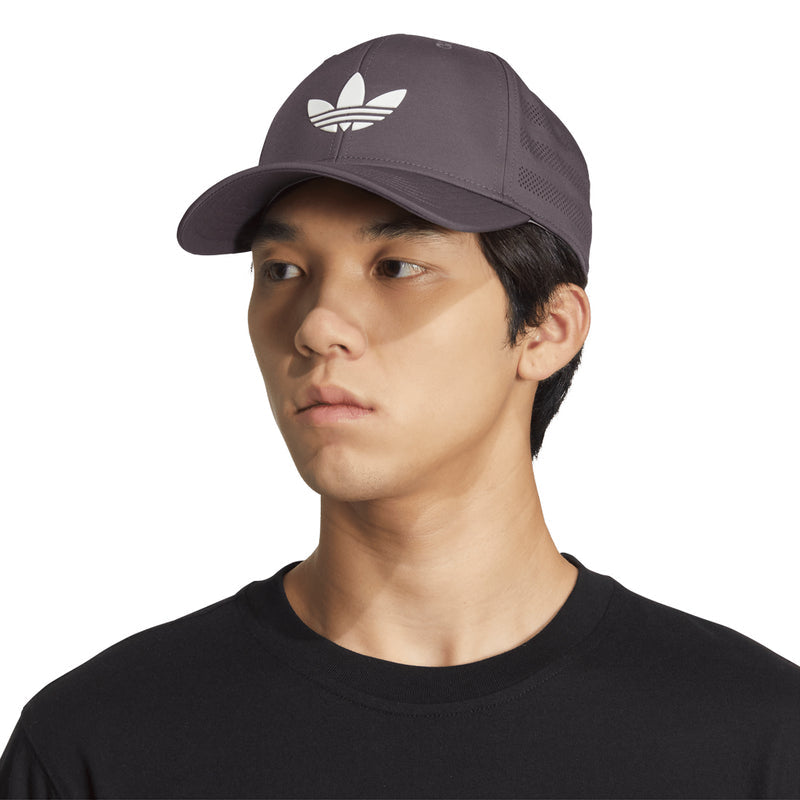 Grey snapback cap worn by model, adidas trefoil logo on the front panel