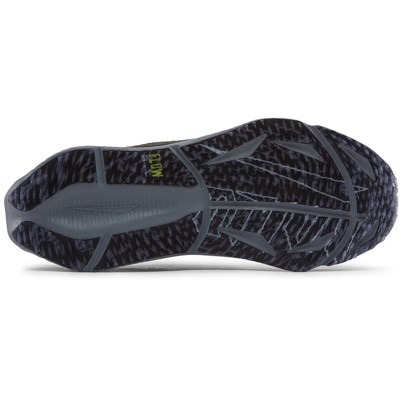 Close-up of a black and gray athletic shoe sole on a white background