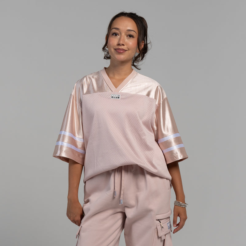 Womens oversized football jersey in sepia rose with V-neck and white striped sleeves