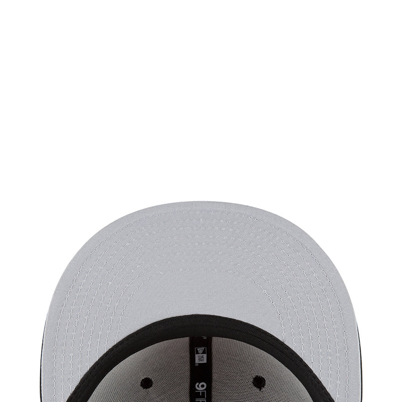 White baseball cap with textured crown and black inner brim