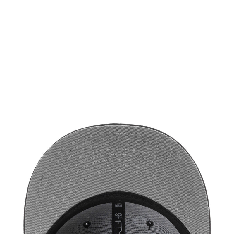 Gray interior of baseball cap with black headband and label