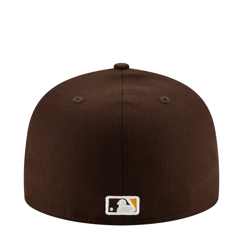 Brown baseball cap back panel with white logo patch