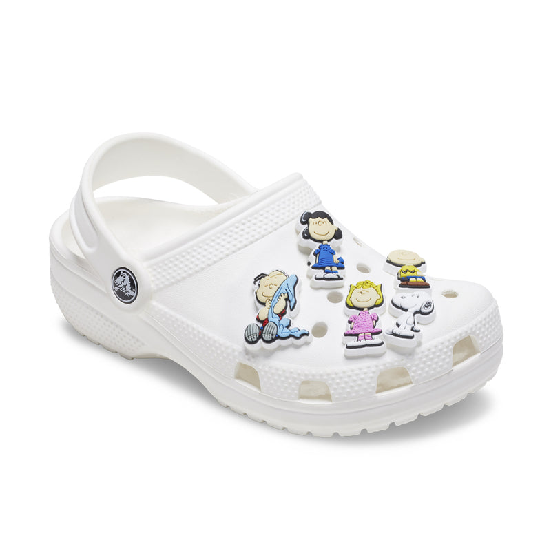 White Crocs-style clog with five Peanuts Jibbitz charms, Snoopy and Charlie Brown