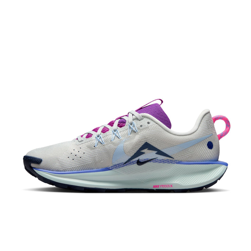 Women's trail running shoe side view, light gray with blue midsole and purple collar