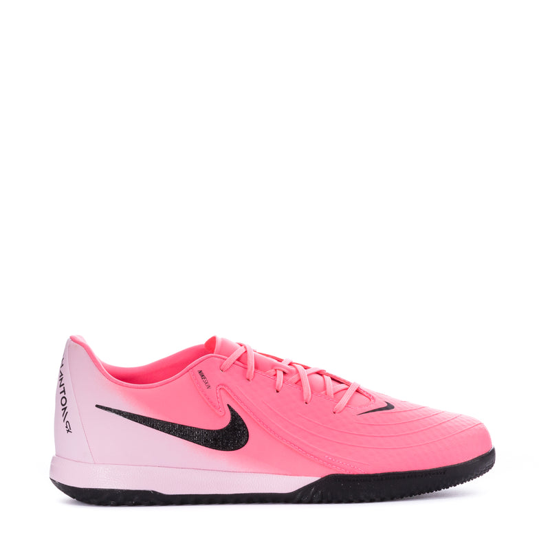 Pink soccer cleat with black sole, black Swoosh, and lace-up front