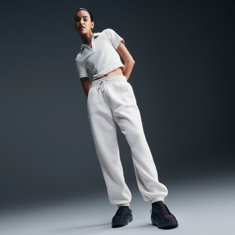 Women’s off-white jogger pants, 3/4 front: relaxed fit with elastic waist and cuffed hem