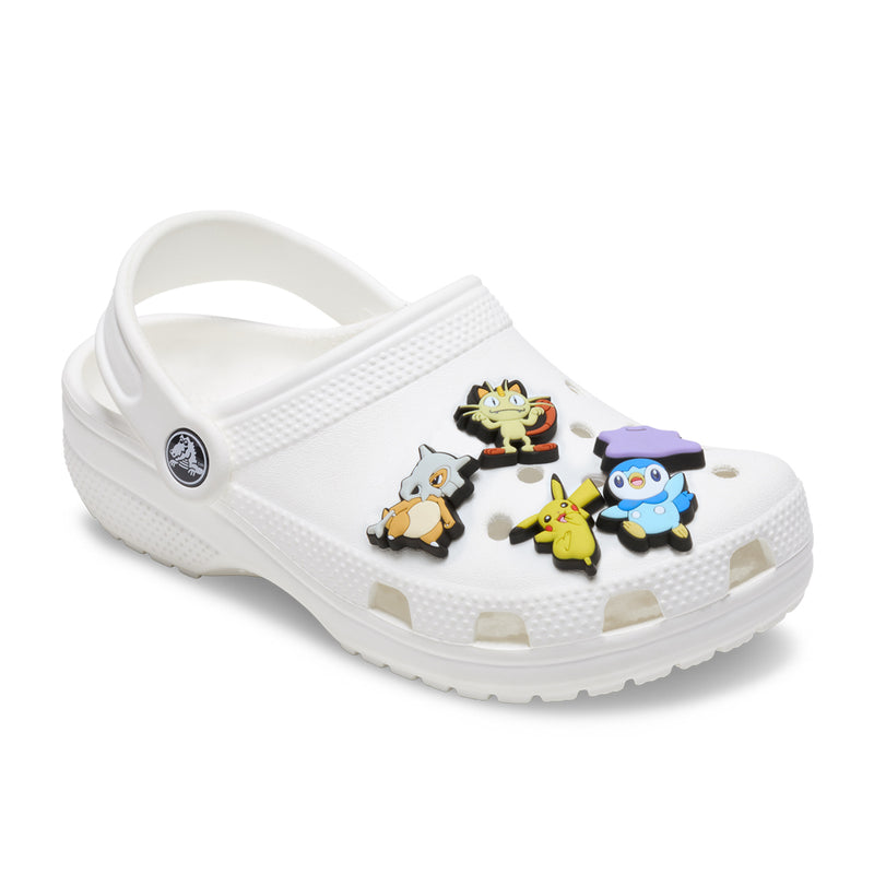 White clog with five Pokemon character Jibbitz charms attached