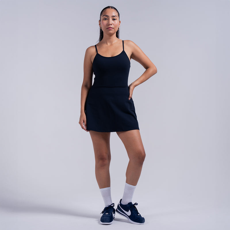 Black A-line skater dress with spaghetti straps and fitted waist seam