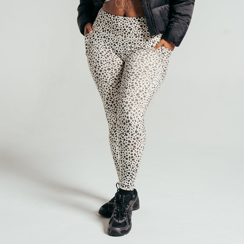 Women's animal dot print pocket leggings, light base with dark dots