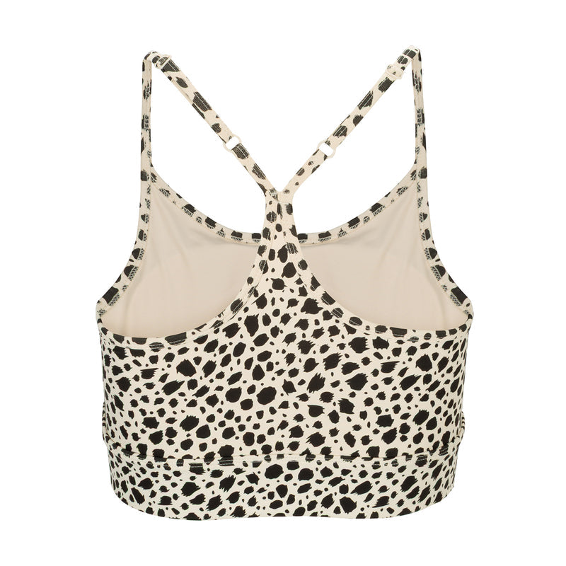 Power sports bra for women in animal dot print, open V-back and crisscross straps